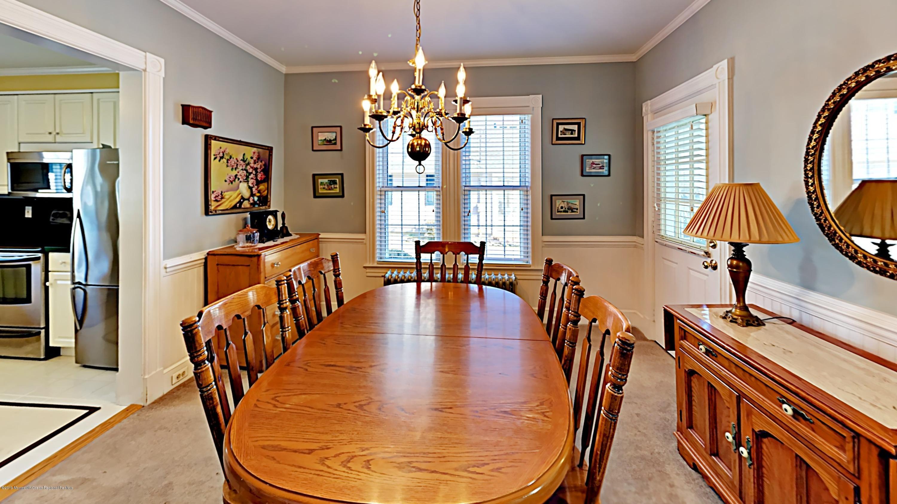606 Ocean Road Spring Lake Heights, NJ 07762 - Photo 13 of 42 a view of a dining room with furniture window and wooden floor