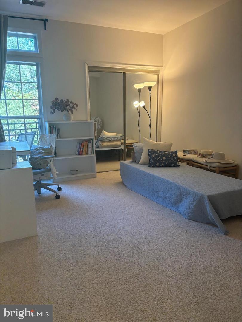 1334 Garden Wall Circle, Unit C Reston, VA 20194 - Photo 15 of 22 a living room with furniture and a large window