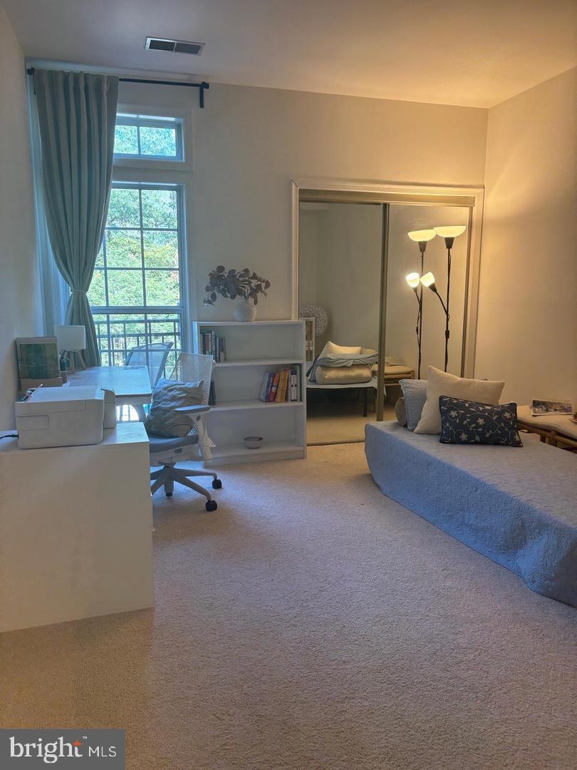 1334 Garden Wall Circle, Unit C Reston, VA 20194 - Photo 16 of 22 a living room with furniture and a large window