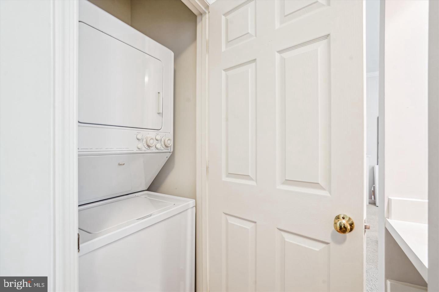 1334 Garden Wall Circle, Unit C Reston, VA 20194 - Photo 18 of 22 a utility room with dryer and washer