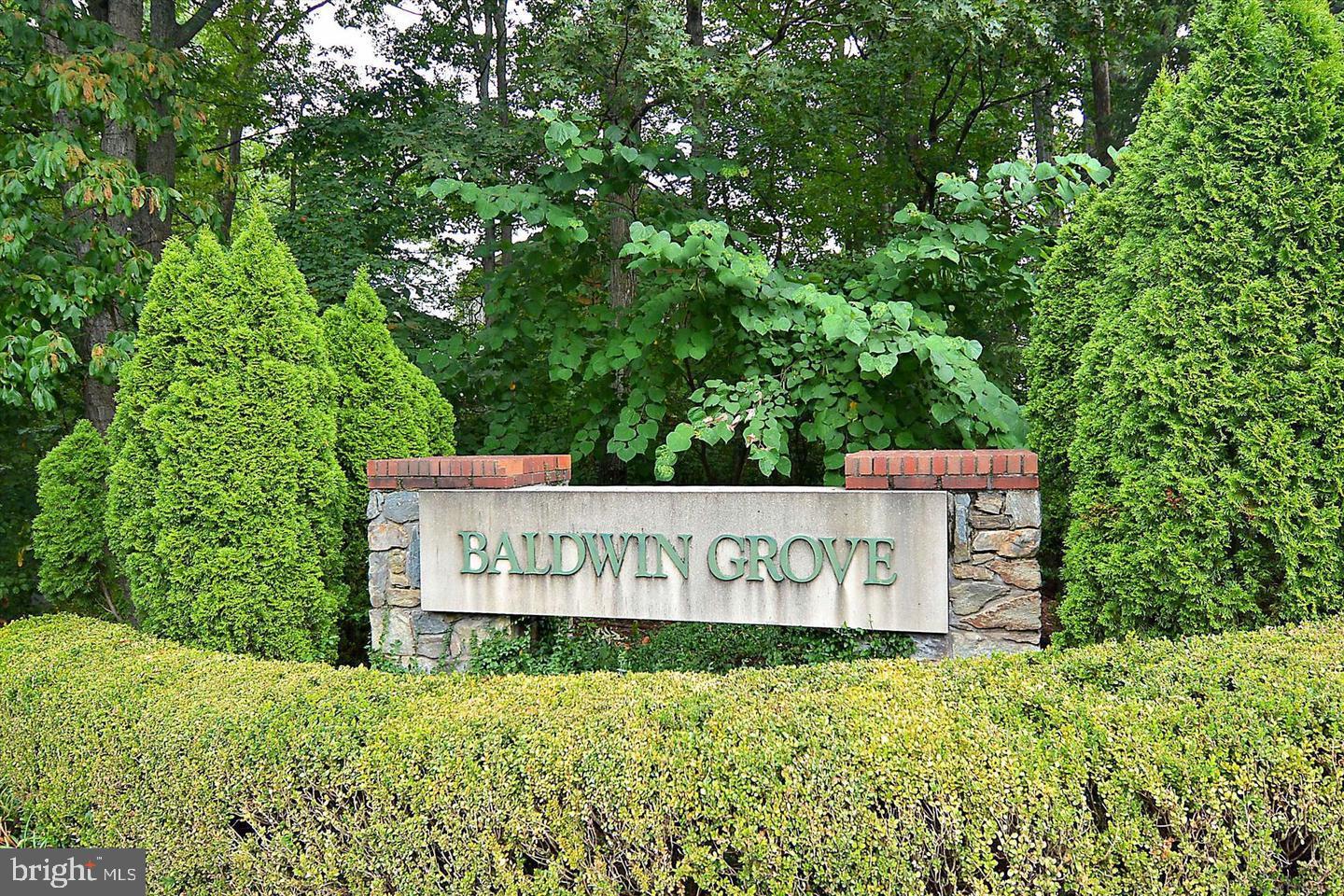 1334 Garden Wall Circle, Unit C Reston, VA 20194 - Photo 21 of 22 a sign of golf club on a wall under a tree