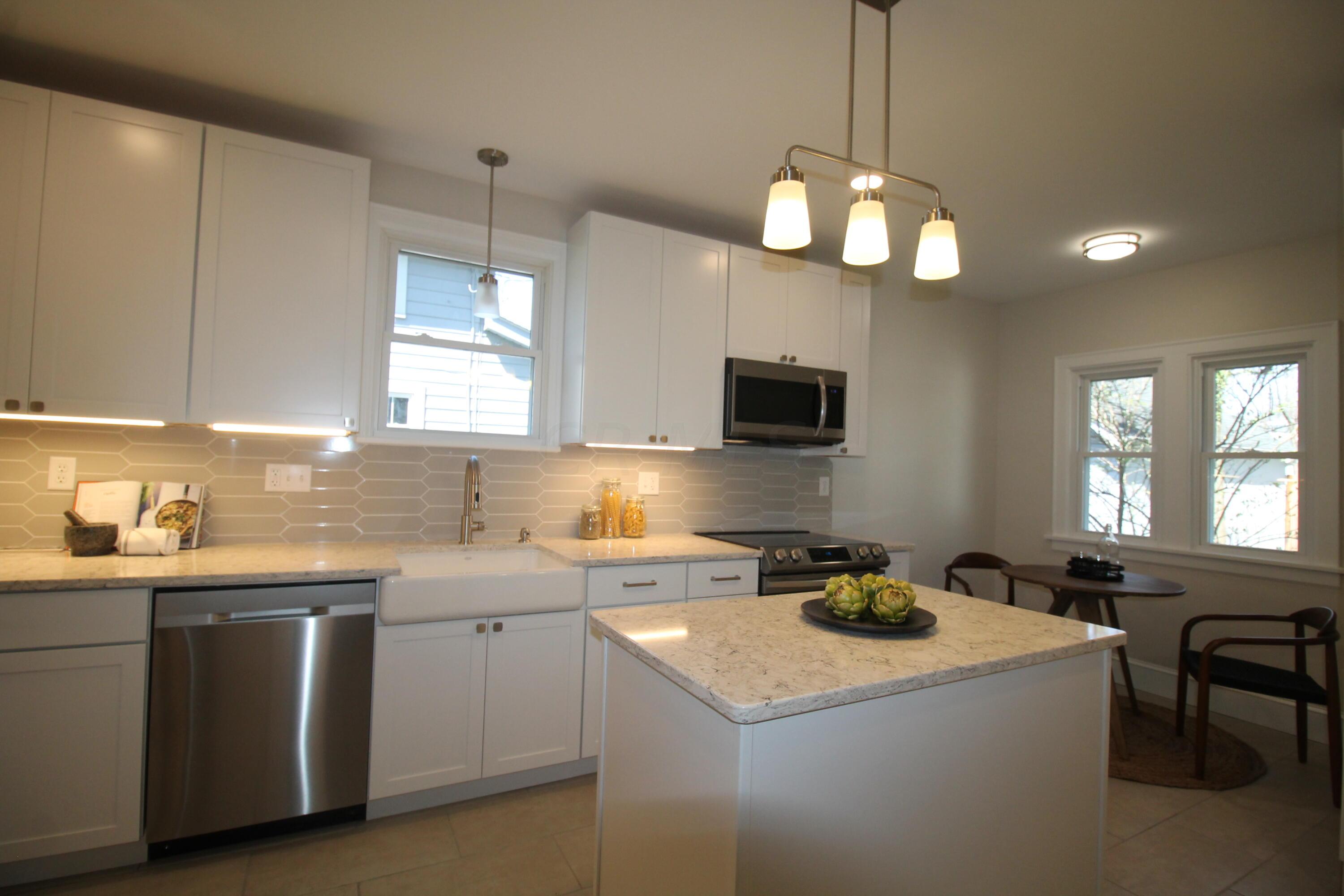 108 Garden Road Columbus, OH 43214 - Photo 6 of 20 Dream kitchen with new SS appliances, recessed lighting, prep island and eat in area