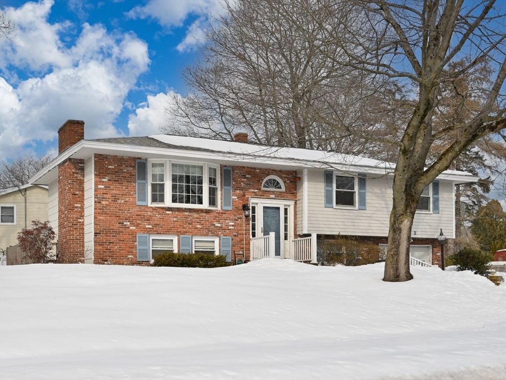 2 Iroquois Road Danvers, MA 01923 - Photo 1 of 30 a front view of a house with a yard