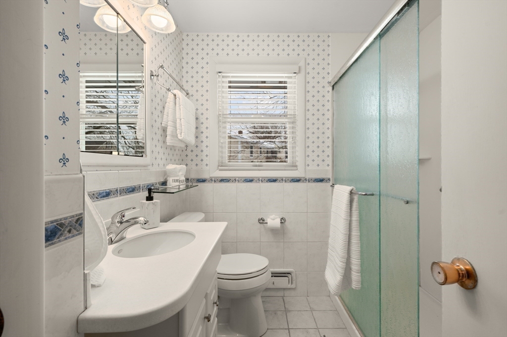 2 Iroquois Road Danvers, MA 01923 - Photo 11 of 30 a bathroom with a sink toilet and shower