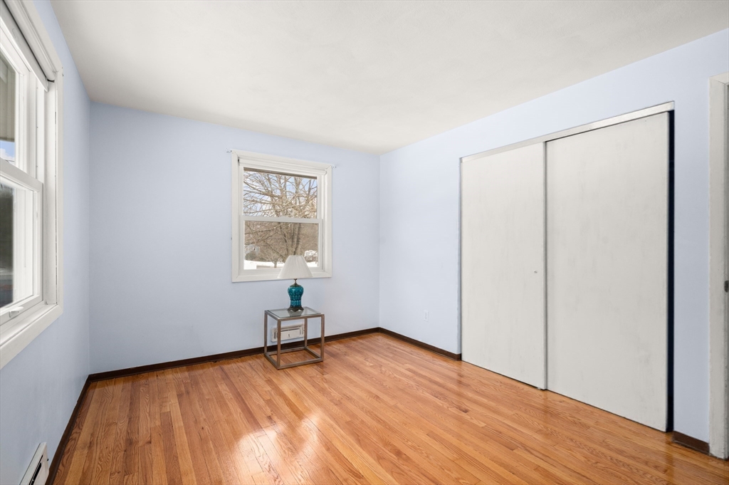 2 Iroquois Road Danvers, MA 01923 - Photo 16 of 30 a view of empty room with wooden floor and fan