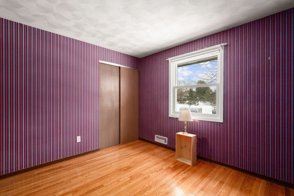 2 Iroquois Road Danvers, MA 01923 - Photo 18 of 30 an empty room with wooden floor and windows