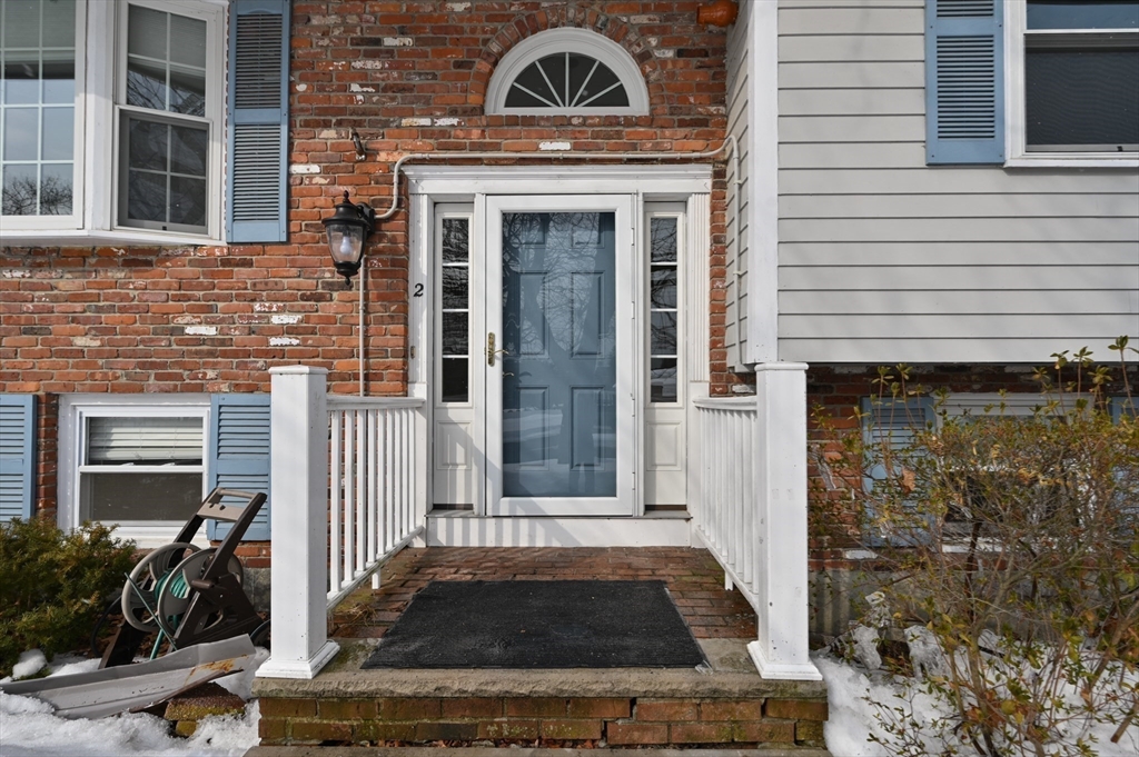 2 Iroquois Road Danvers, MA 01923 - Photo 2 of 30 a view of a brick house with many windows
