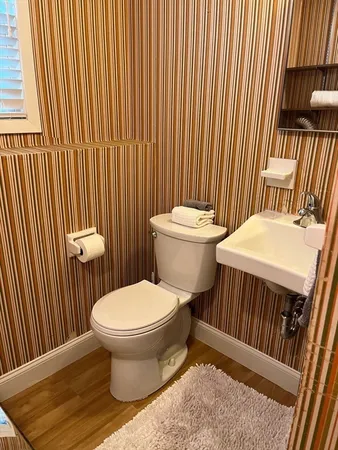 a bathroom with a toilet and a sink