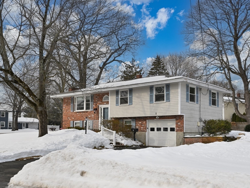 2 Iroquois Road Danvers, MA 01923 - Photo 24 of 30 a front view of a house with a yard covered in snow