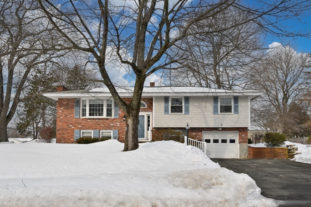2 Iroquois Road Danvers, MA 01923 - Photo 25 of 30 a front view of a house with a yard covered in snow
