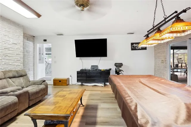 a bed room with two bed and a window