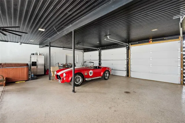 an aerial view of a house with outdoor space