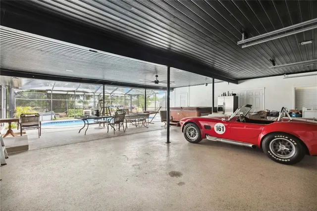 a view of a room with a table and chairs