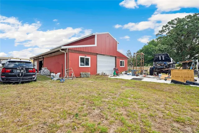 an aerial view of a house with outdoor space