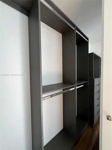 a view of an empty walk in closet