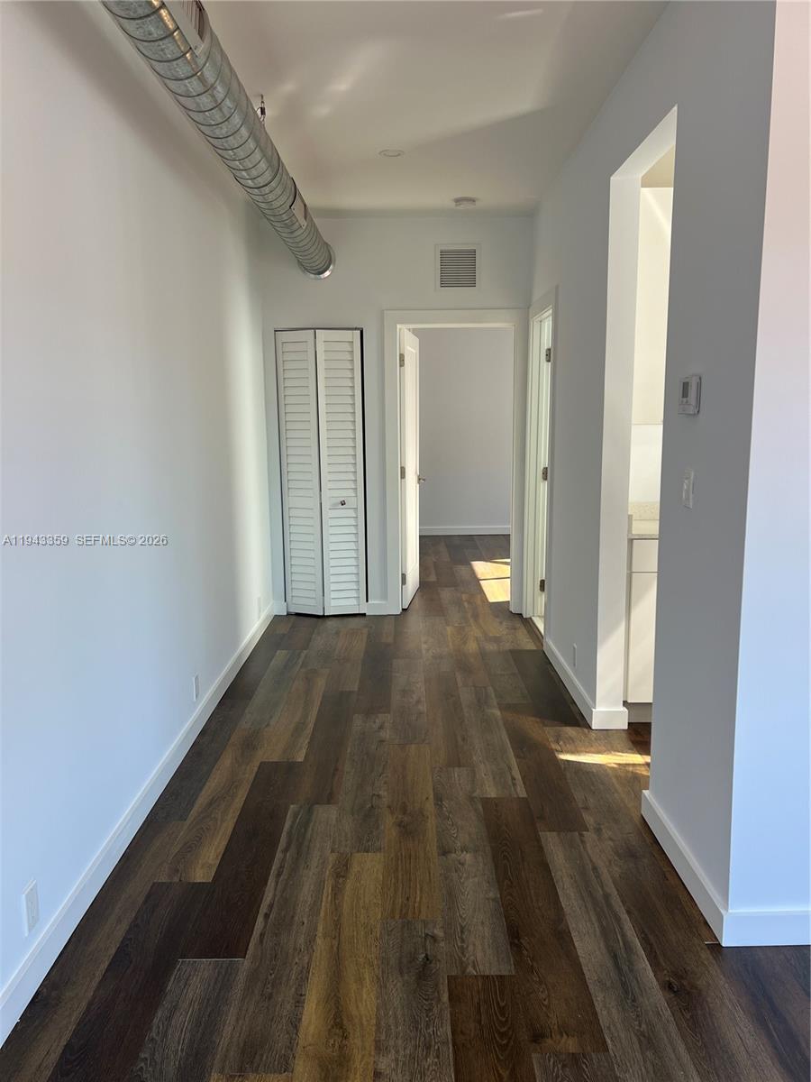 1814 Southwest 22nd Avenue, Unit 7 Miami, FL 33145 - Photo 3 of 13 a view of a room with wooden floor