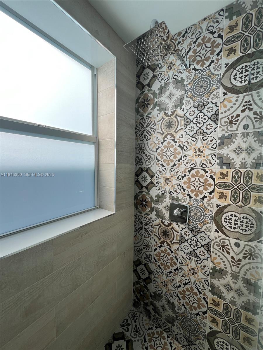 1814 Southwest 22nd Avenue, Unit 7 Miami, FL 33145 - Photo 6 of 13 a bathroom with a shower