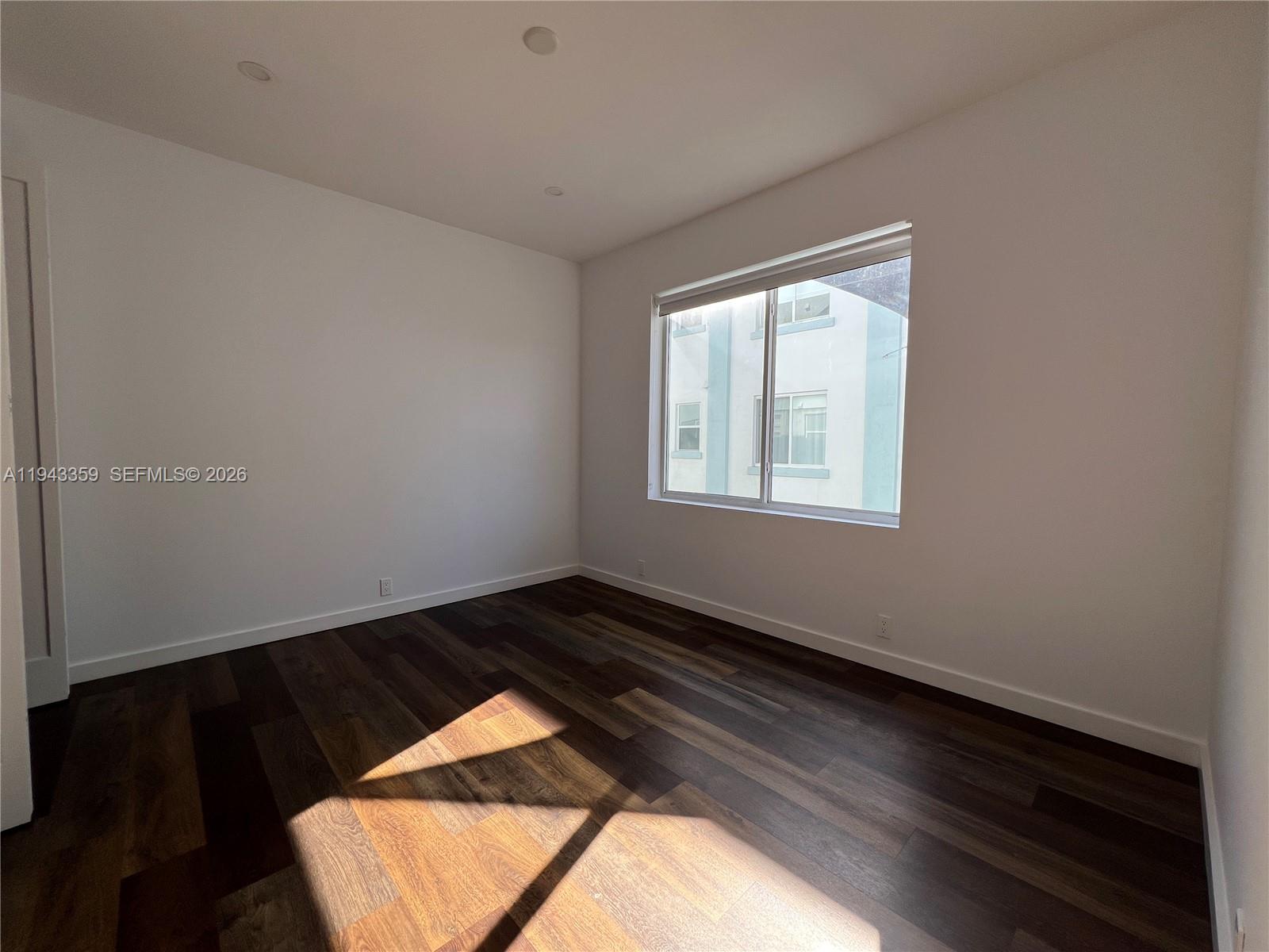 1814 Southwest 22nd Avenue, Unit 7 Miami, FL 33145 - Photo 9 of 13 a view of an empty room and window