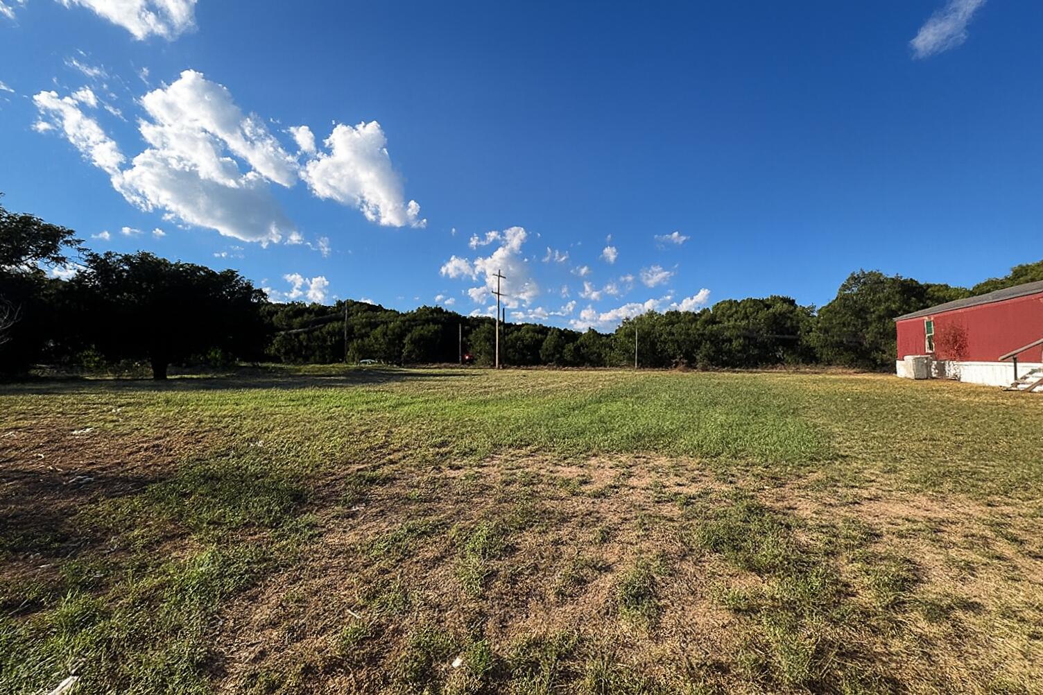 Tbd Tbd 1st Street Littlefield, TX 79339 - Photo 5 of 6 a view of a golf course with a lake