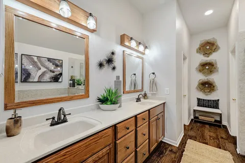 a bathroom with sink and mirror