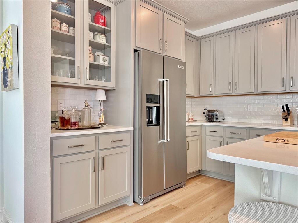 36 Signet Circle Flagler Beach, FL 32136 - Photo 12 of 45 a kitchen with stainless steel appliances white cabinets and a refrigerator