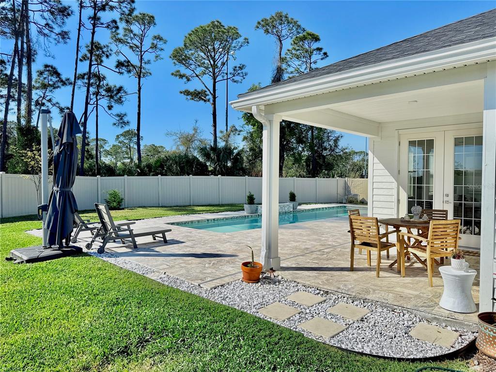 36 Signet Circle Flagler Beach, FL 32136 - Photo 17 of 45 a view of a backyard with a patio