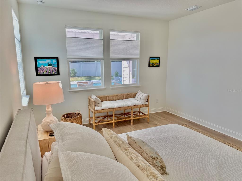 36 Signet Circle Flagler Beach, FL 32136 - Photo 21 of 45 a bedroom with furniture and a window