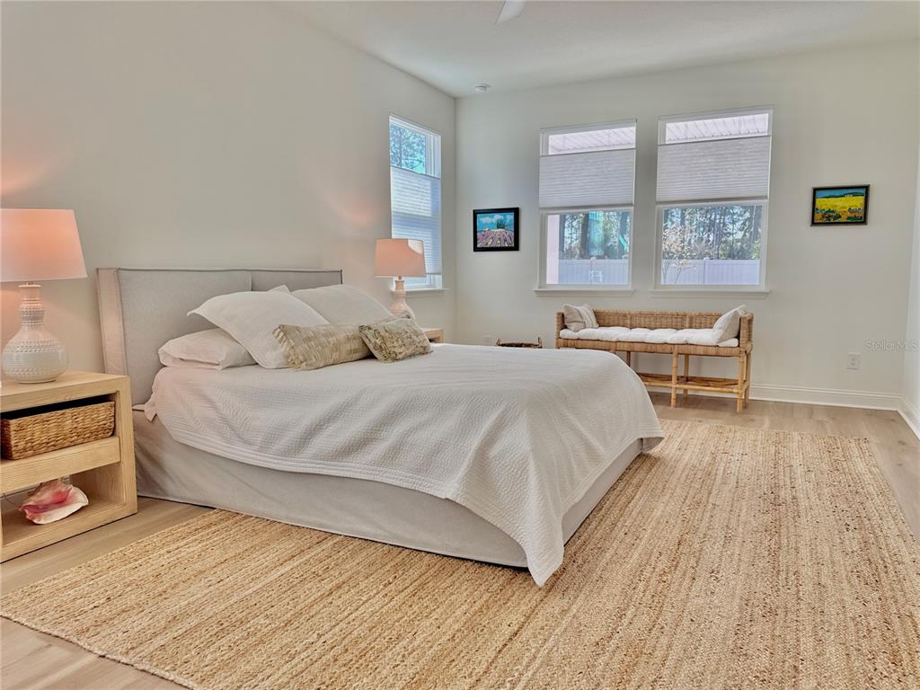 36 Signet Circle Flagler Beach, FL 32136 - Photo 22 of 45 a bedroom with a bed and wooden floor