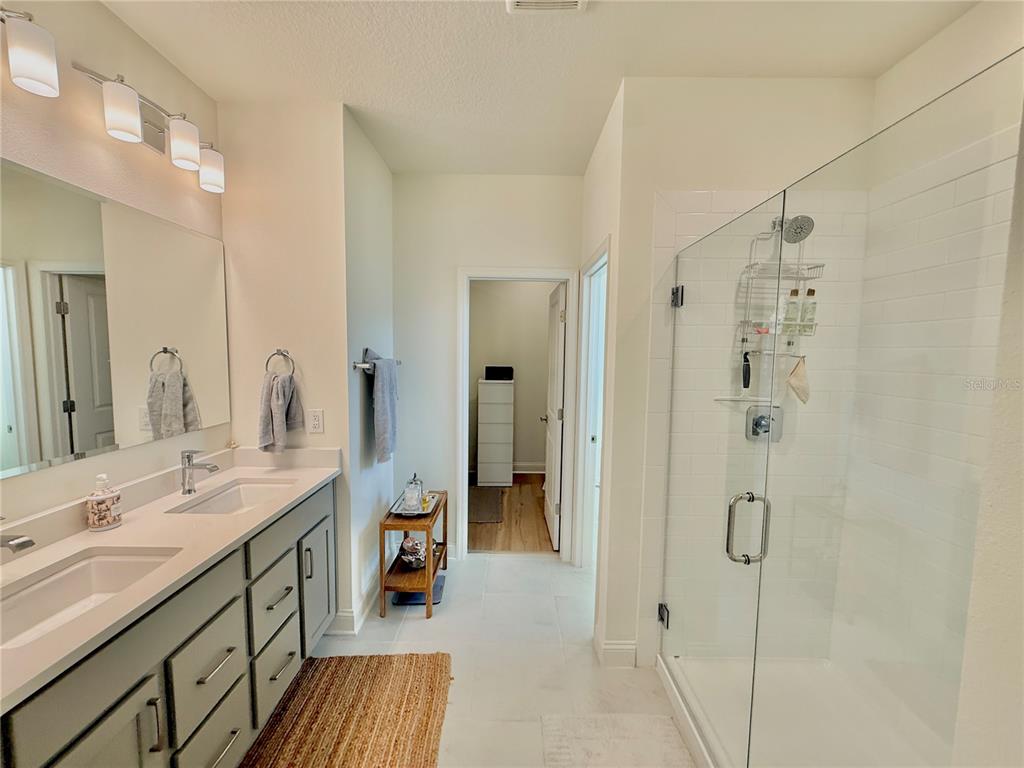 36 Signet Circle Flagler Beach, FL 32136 - Photo 24 of 45 a spacious bathroom with a shower sink and mirror