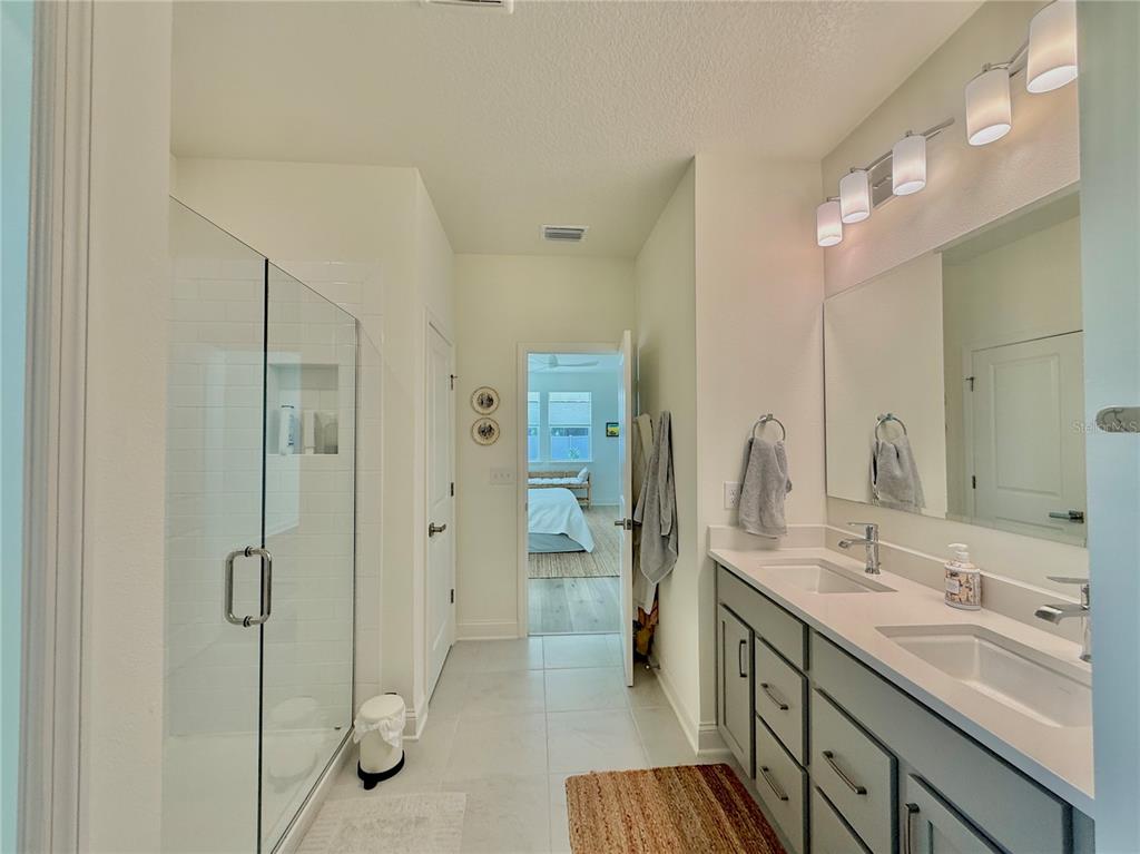 36 Signet Circle Flagler Beach, FL 32136 - Photo 29 of 45 a spacious bathroom with a shower sink and mirror
