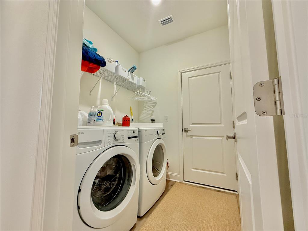 36 Signet Circle Flagler Beach, FL 32136 - Photo 32 of 45 a view of storage and utility room with washer and dryer