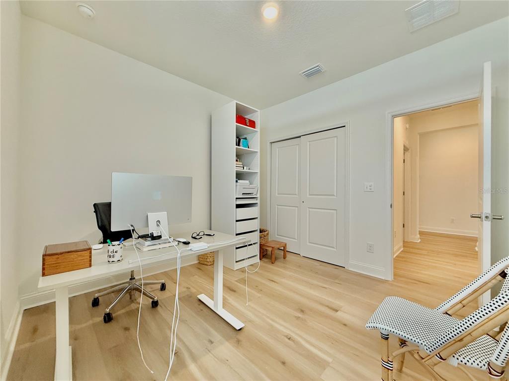 36 Signet Circle Flagler Beach, FL 32136 - Photo 36 of 45 a view of a workspace with furniture and wooden floor