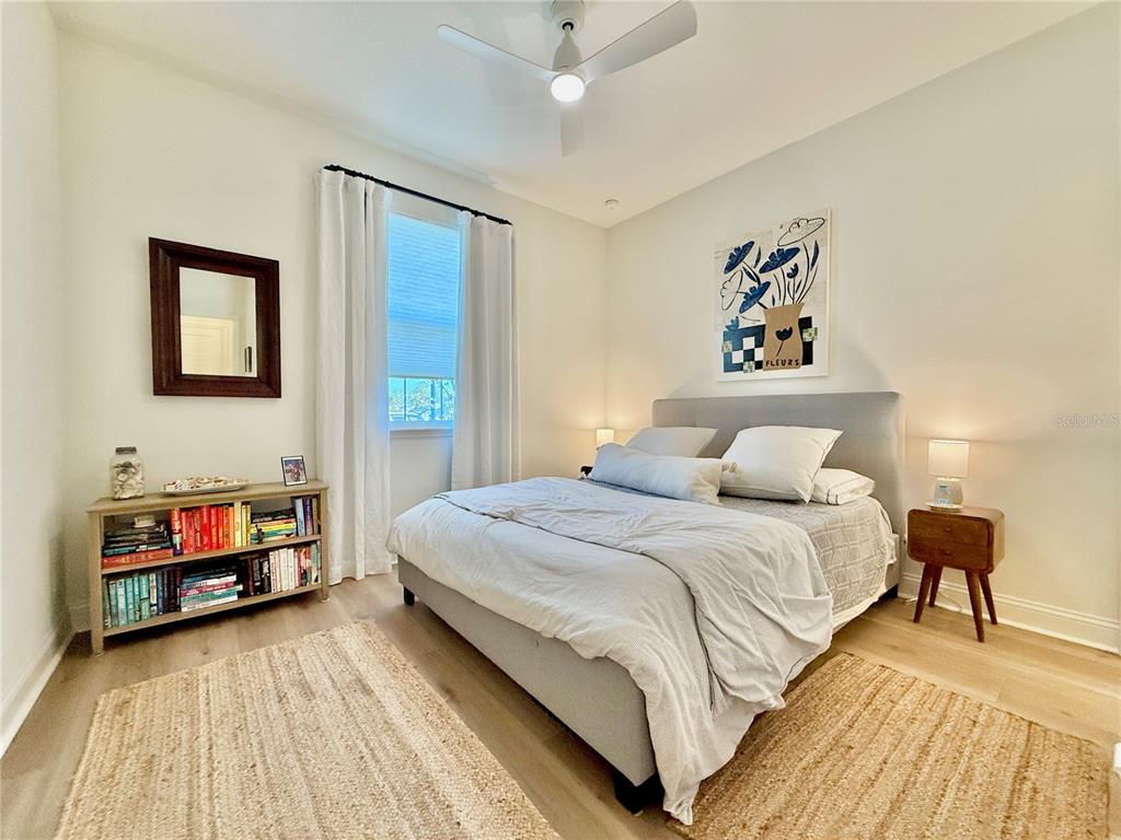 36 Signet Circle Flagler Beach, FL 32136 - Photo 39 of 45 a bedroom with a bed and a chandelier