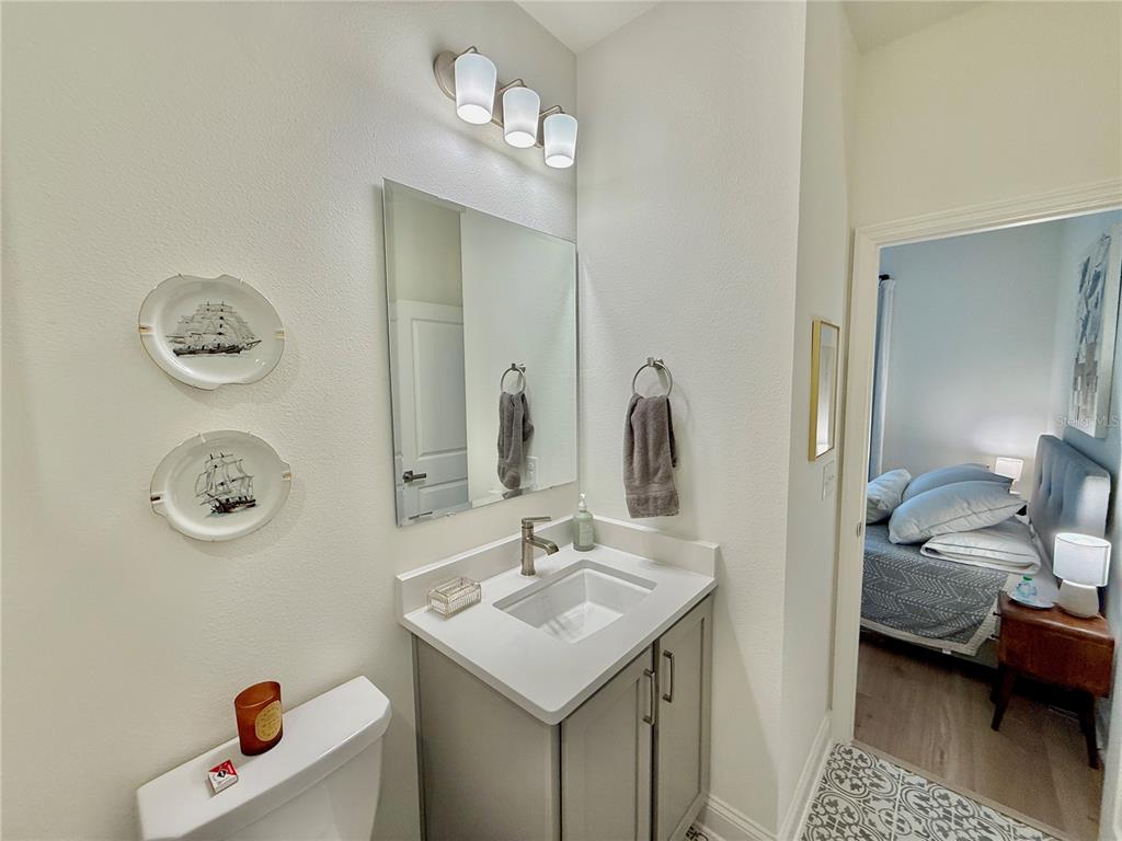 36 Signet Circle Flagler Beach, FL 32136 - Photo 42 of 45 a en suite bathroom with a sink and a mirror