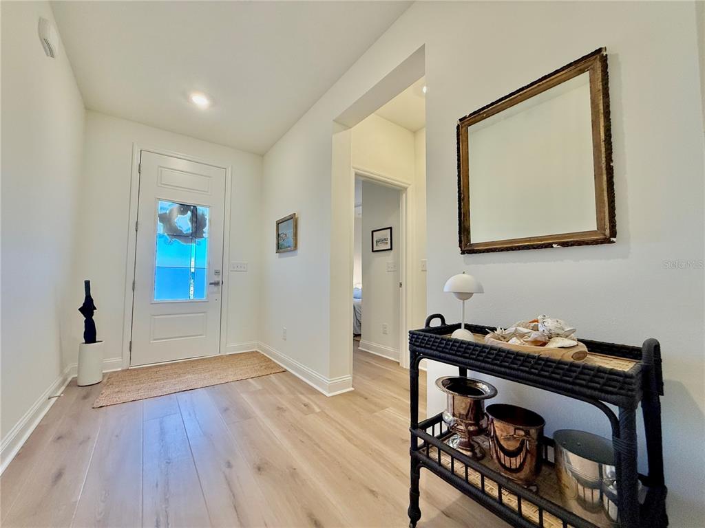 36 Signet Circle Flagler Beach, FL 32136 - Photo 5 of 45 a view of empty room with wooden floor