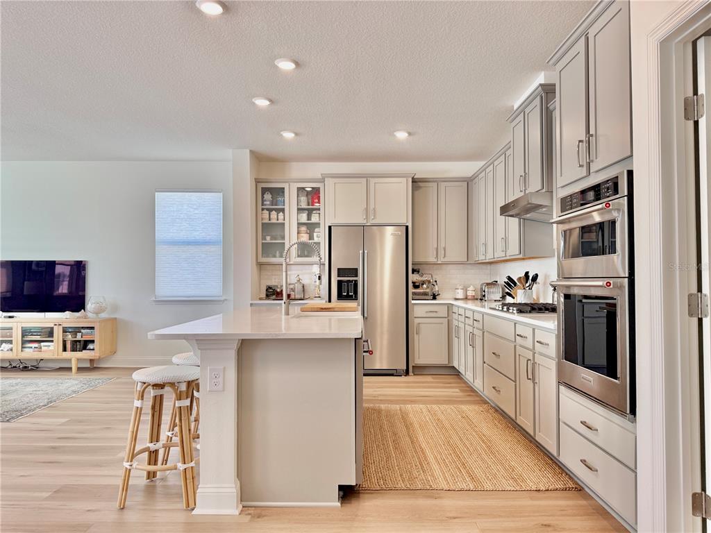 36 Signet Circle Flagler Beach, FL 32136 - Photo 9 of 45 a kitchen with stainless steel appliances granite countertop a refrigerator sink and stove