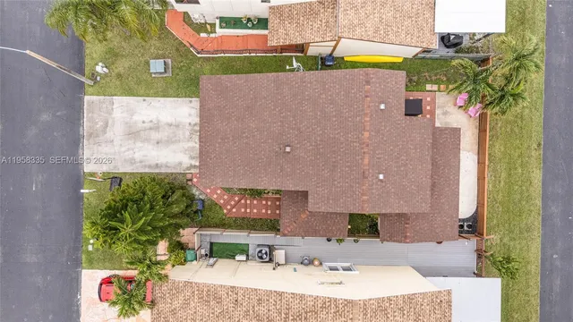 an aerial view of a house with swimming pool