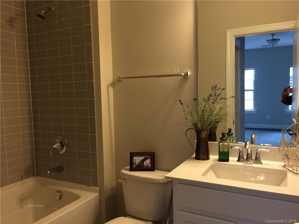 121 Helton Lane, Unit 47 Fort Mill, SC 29708 - Photo 14 of 20 a bathroom with a sink and a bathtub