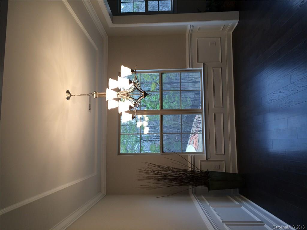 121 Helton Lane, Unit 47 Fort Mill, SC 29708 - Photo 17 of 20 a view of a livingroom with a large window and wooden floor
