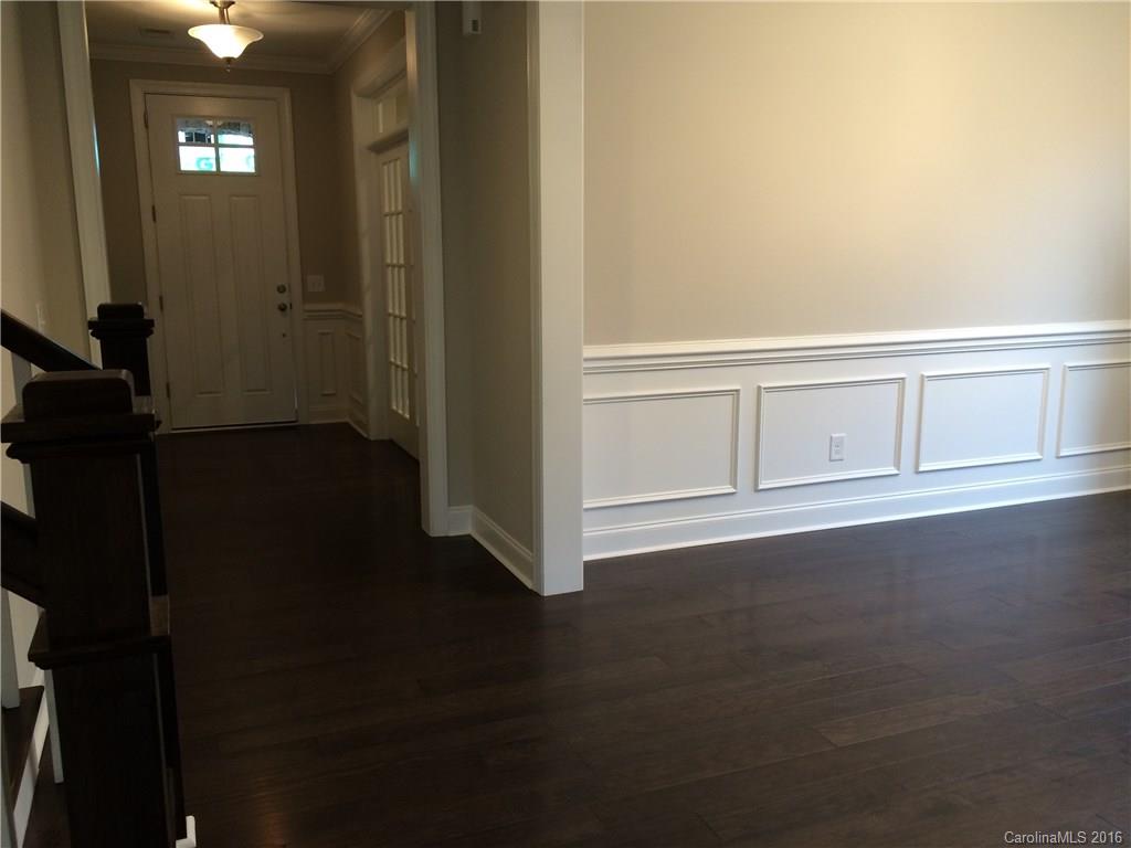 121 Helton Lane, Unit 47 Fort Mill, SC 29708 - Photo 19 of 20 an empty room with wooden floor
