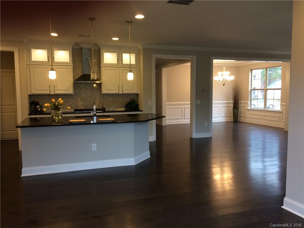 121 Helton Lane, Unit 47 Fort Mill, SC 29708 - Photo 5 of 20 a room with wooden floor and large windows