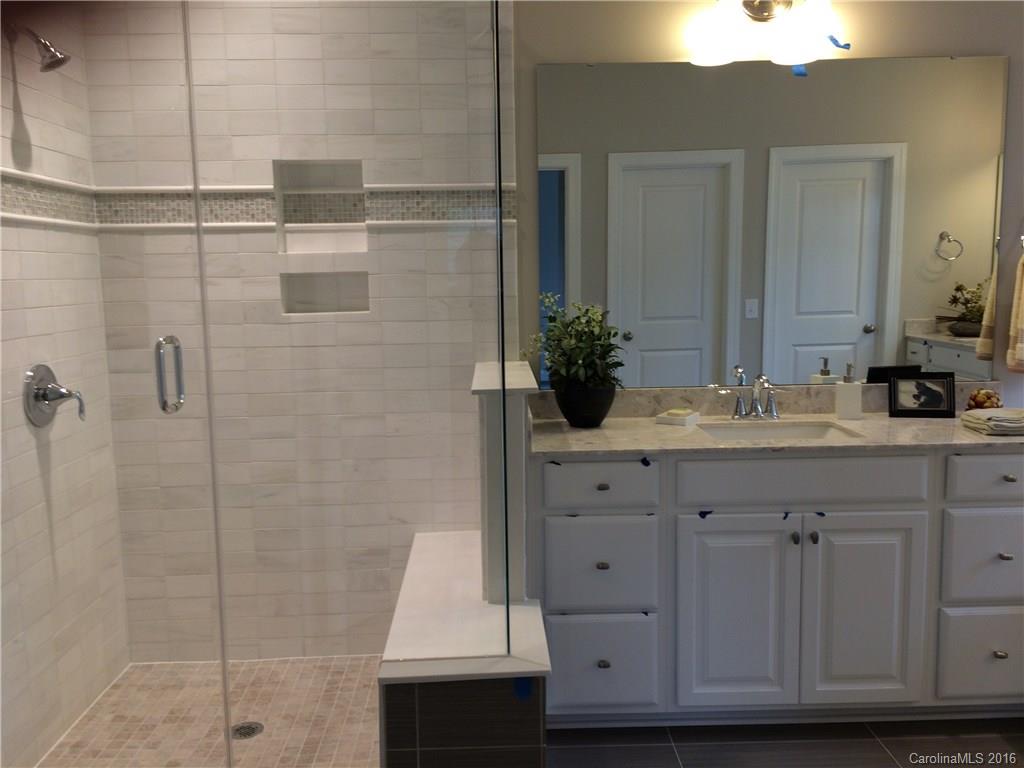 121 Helton Lane, Unit 47 Fort Mill, SC 29708 - Photo 7 of 20 a bathroom with a sink and a mirror