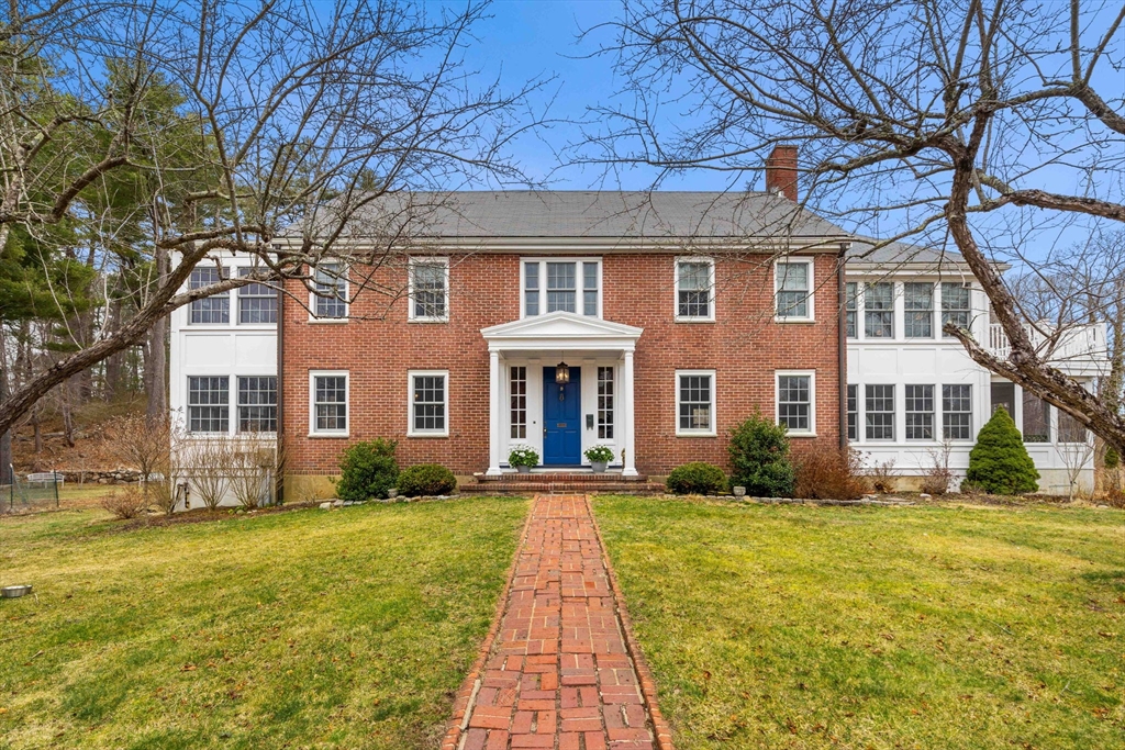 a front view of a house with a yard