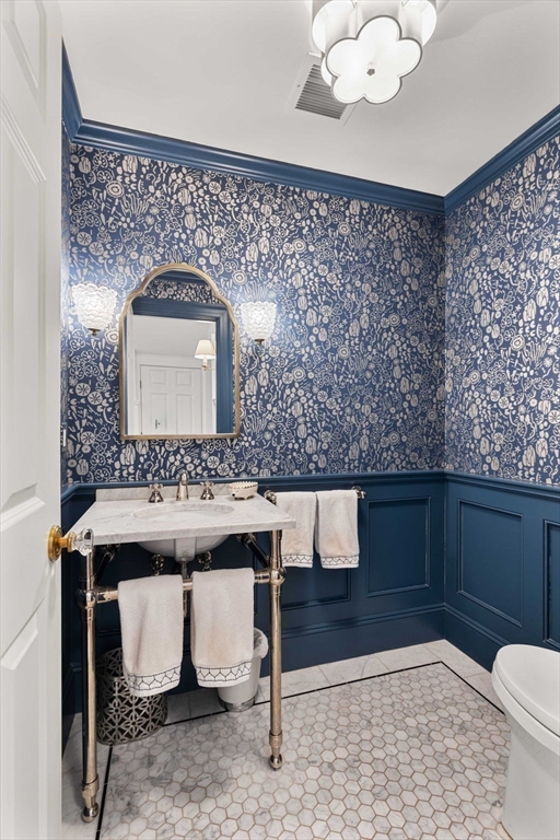 9 Windemere Park Manchester, MA 01944 - Photo 11 of 31 a bathroom with a sink a toilet and mirror