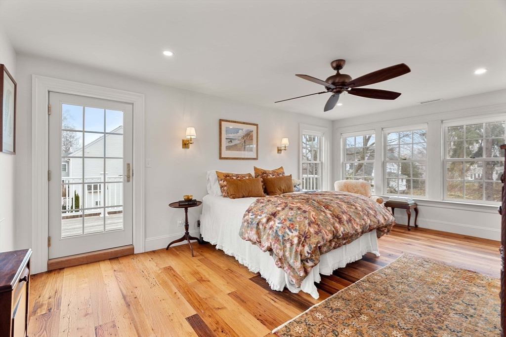 9 Windemere Park Manchester, MA 01944 - Photo 12 of 31 a spacious bedroom with a large bed and a large window