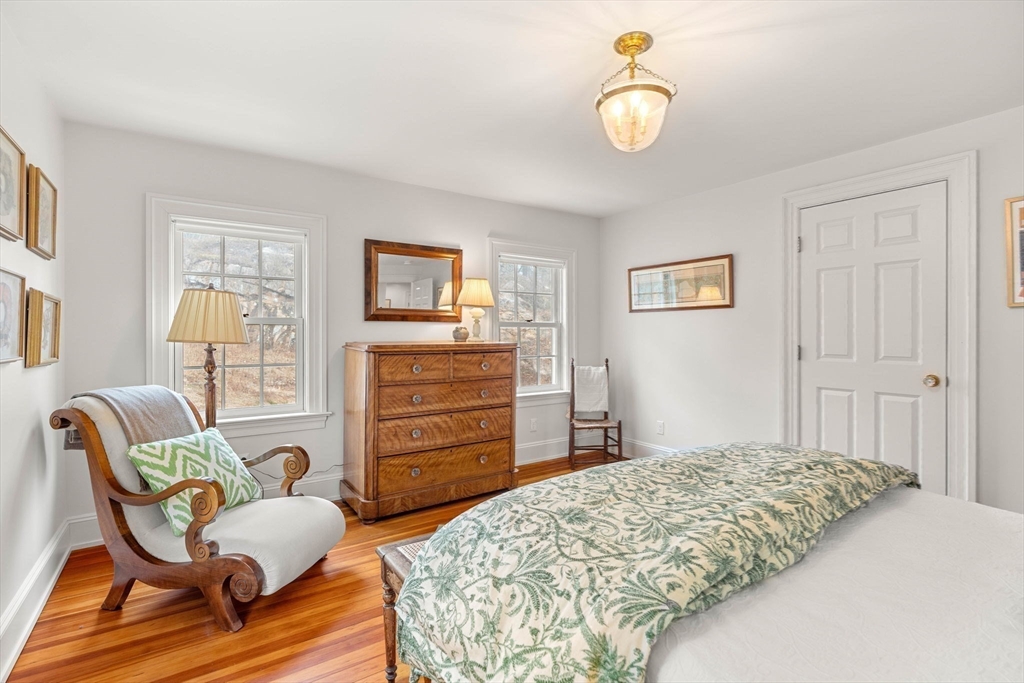 9 Windemere Park Manchester, MA 01944 - Photo 18 of 31 a bedroom with a bed and furniture