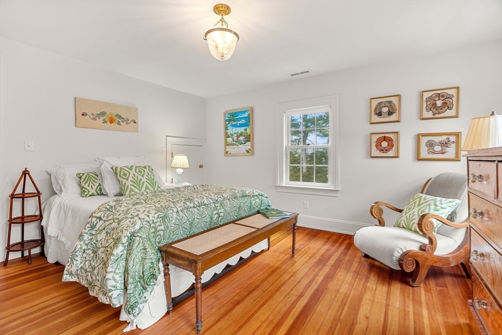 9 Windemere Park Manchester, MA 01944 - Photo 19 of 31 a bedroom with a bed and wooden floor