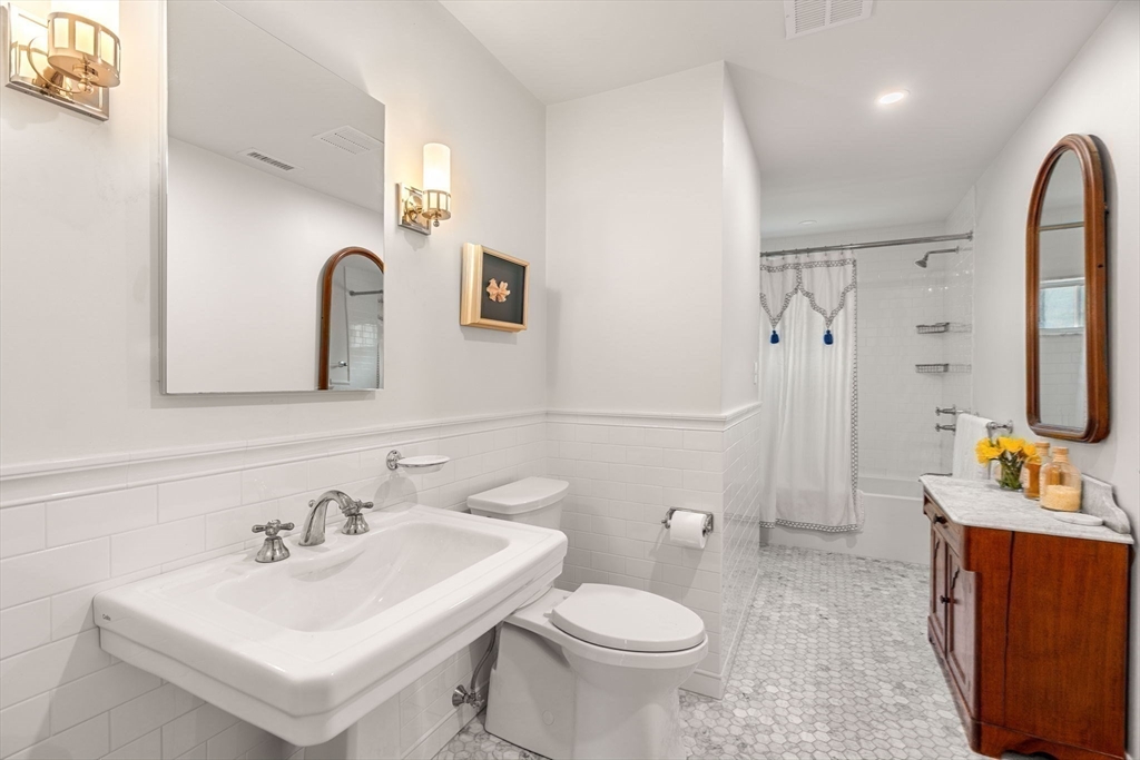 9 Windemere Park Manchester, MA 01944 - Photo 20 of 31 a bathroom with a sink toilet and mirror