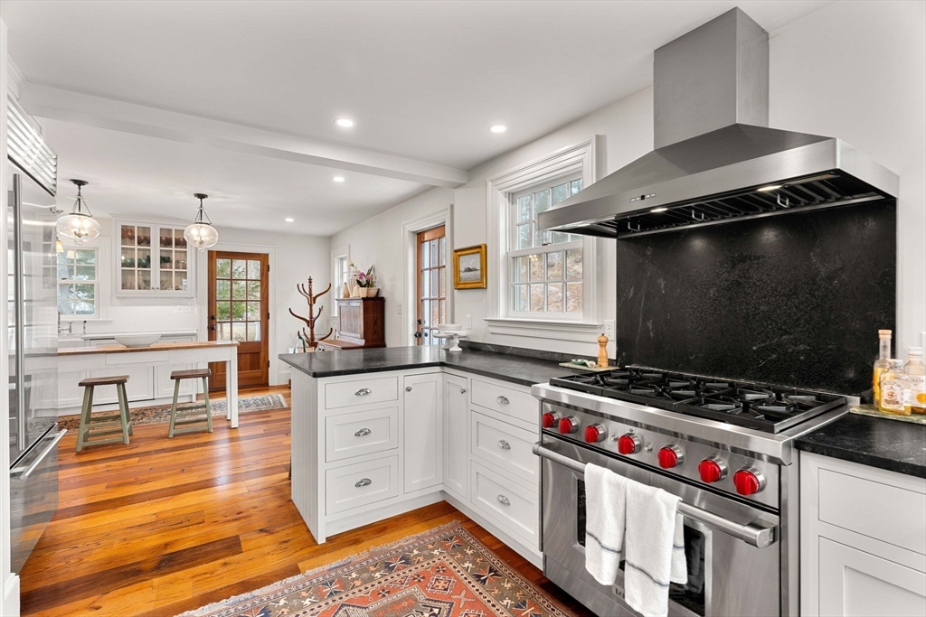 9 Windemere Park Manchester, MA 01944 - Photo 4 of 31 a kitchen with stainless steel appliances granite countertop a stove and a sink