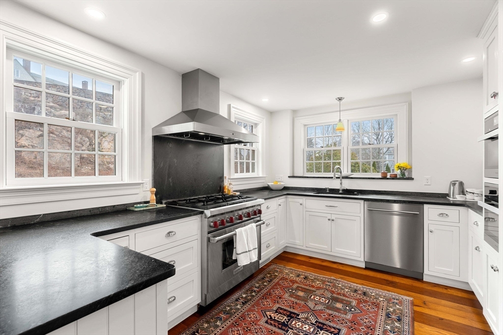 9 Windemere Park Manchester, MA 01944 - Photo 5 of 31 a kitchen with granite countertop a sink stainless steel appliances and window